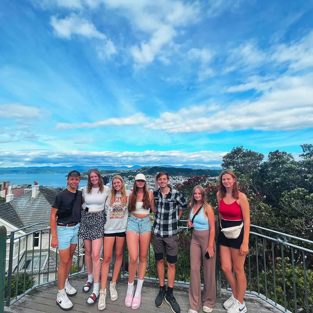 Group smile for photo with view