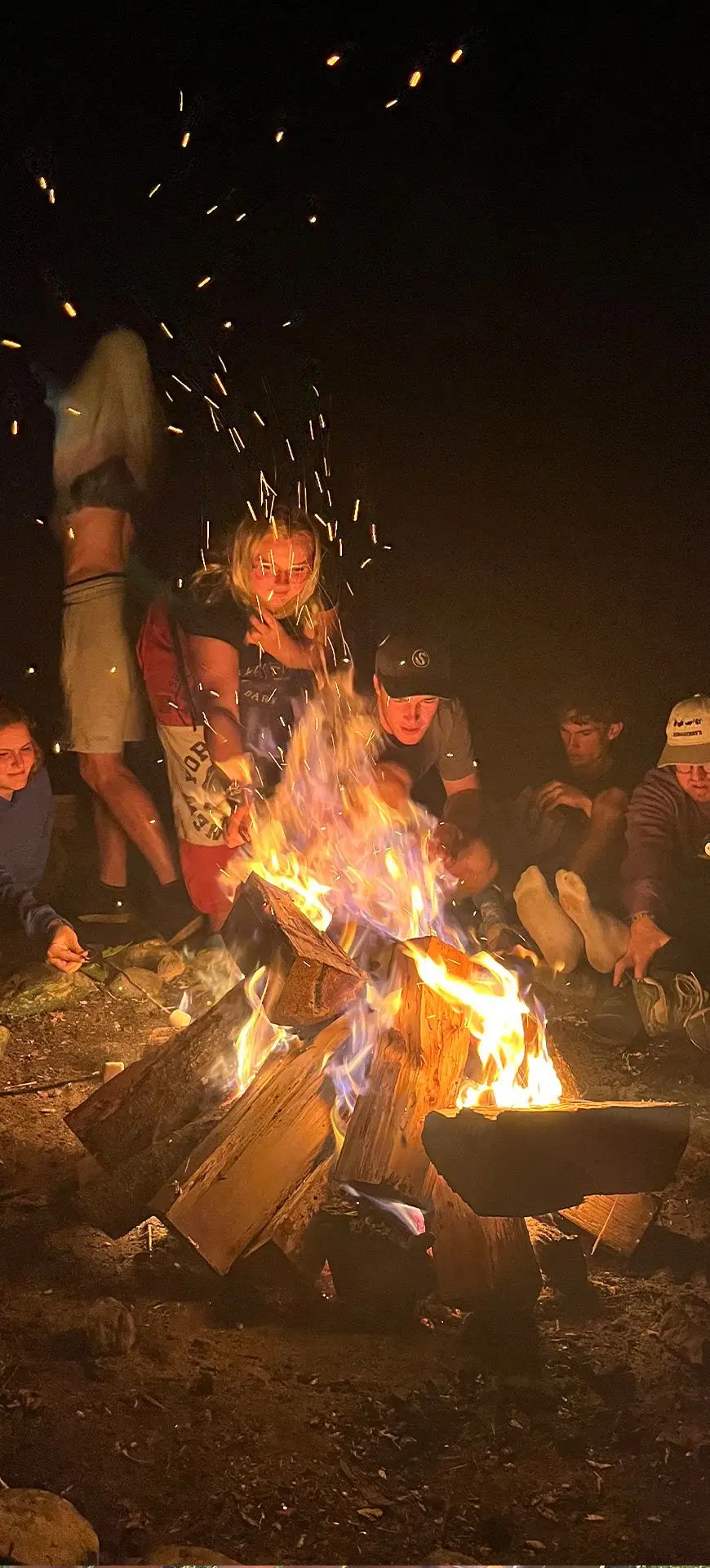 People gathered around a campfire